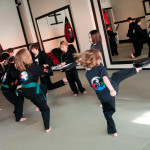 Kids Kicking during Martial Arts Class