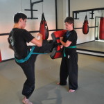 Youth Kicking During Martial Arts Class